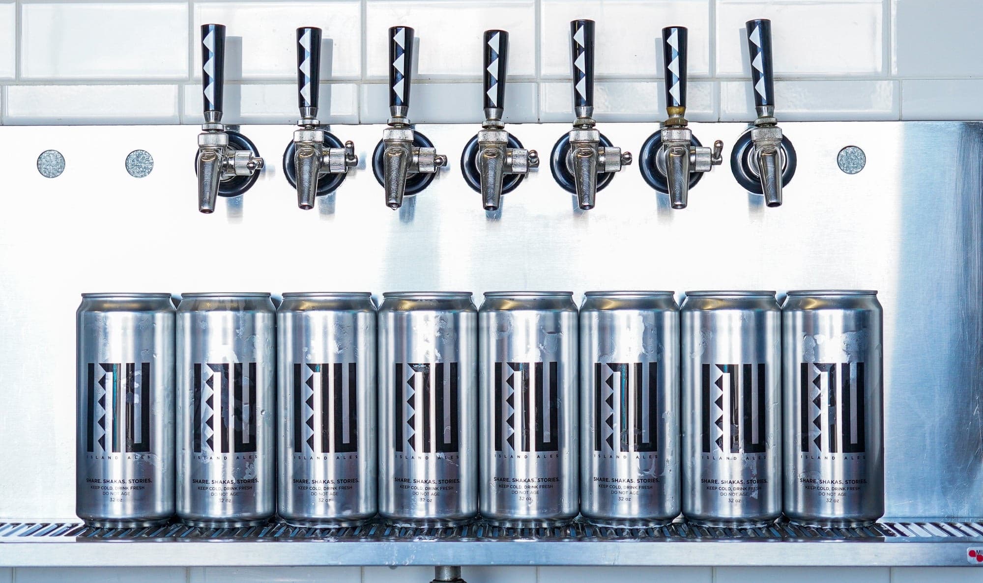 Inu Island Ales — crowler cans tap row