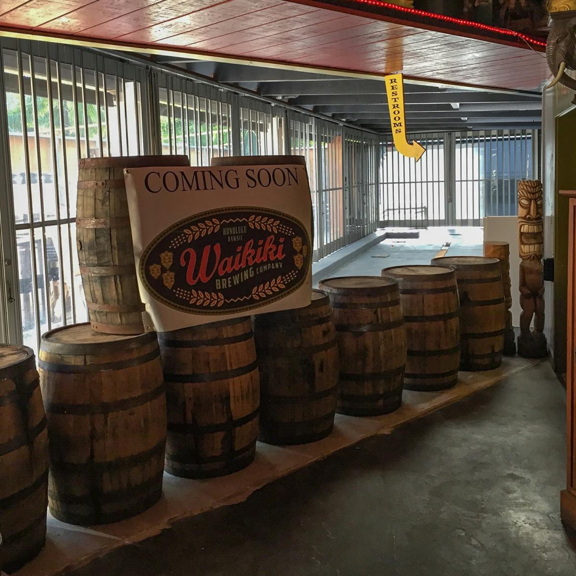 Waikiki Brewing Company — wooden barrels coming soon sign