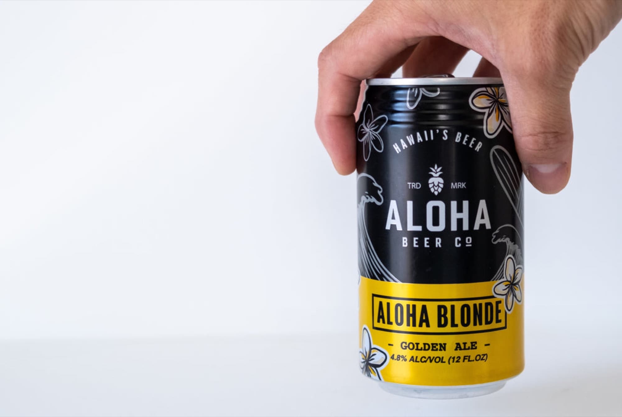 Aloha Beer Company — blonde ale can hand hold
