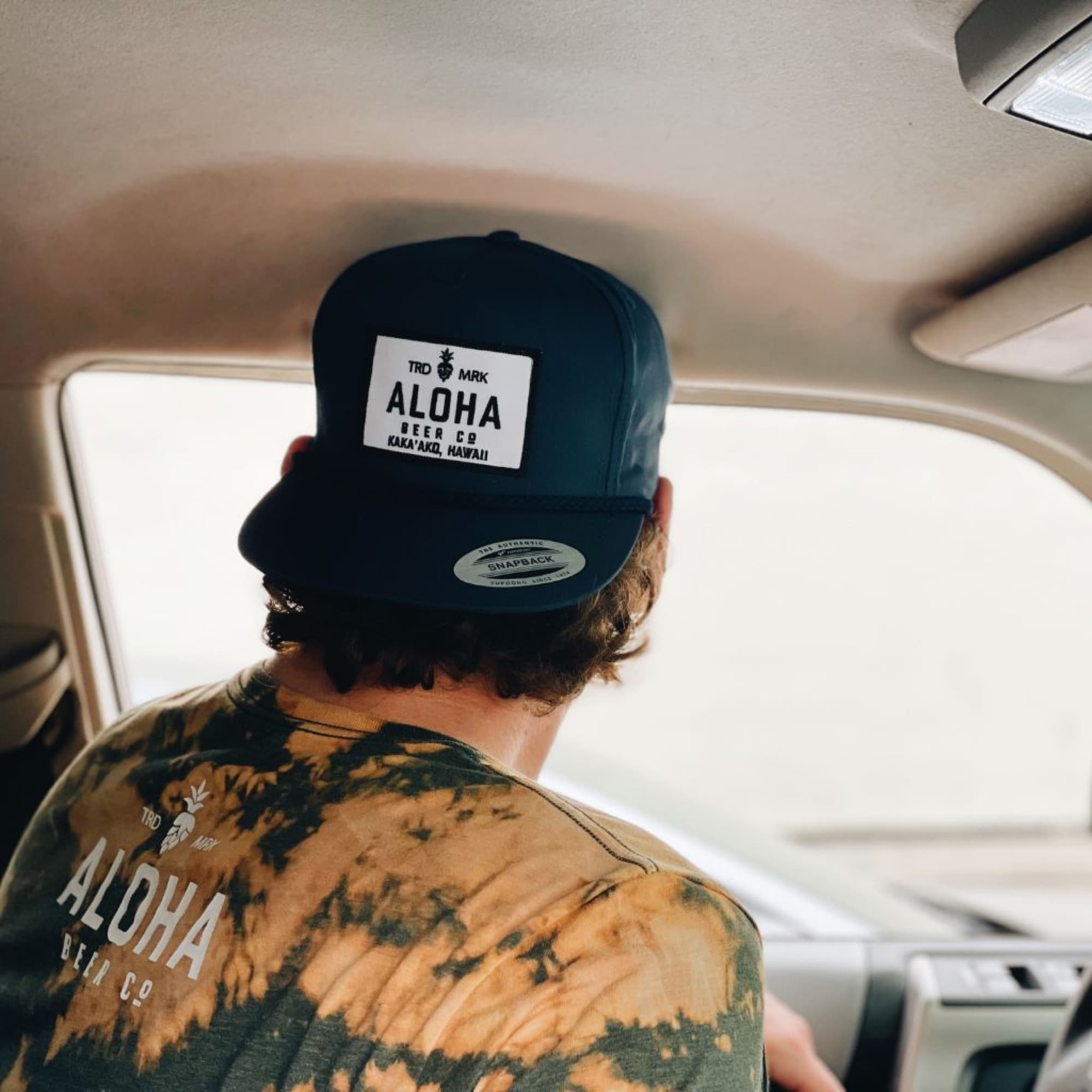 Aloha Beer Company — branded snapback hat tie dye shirt