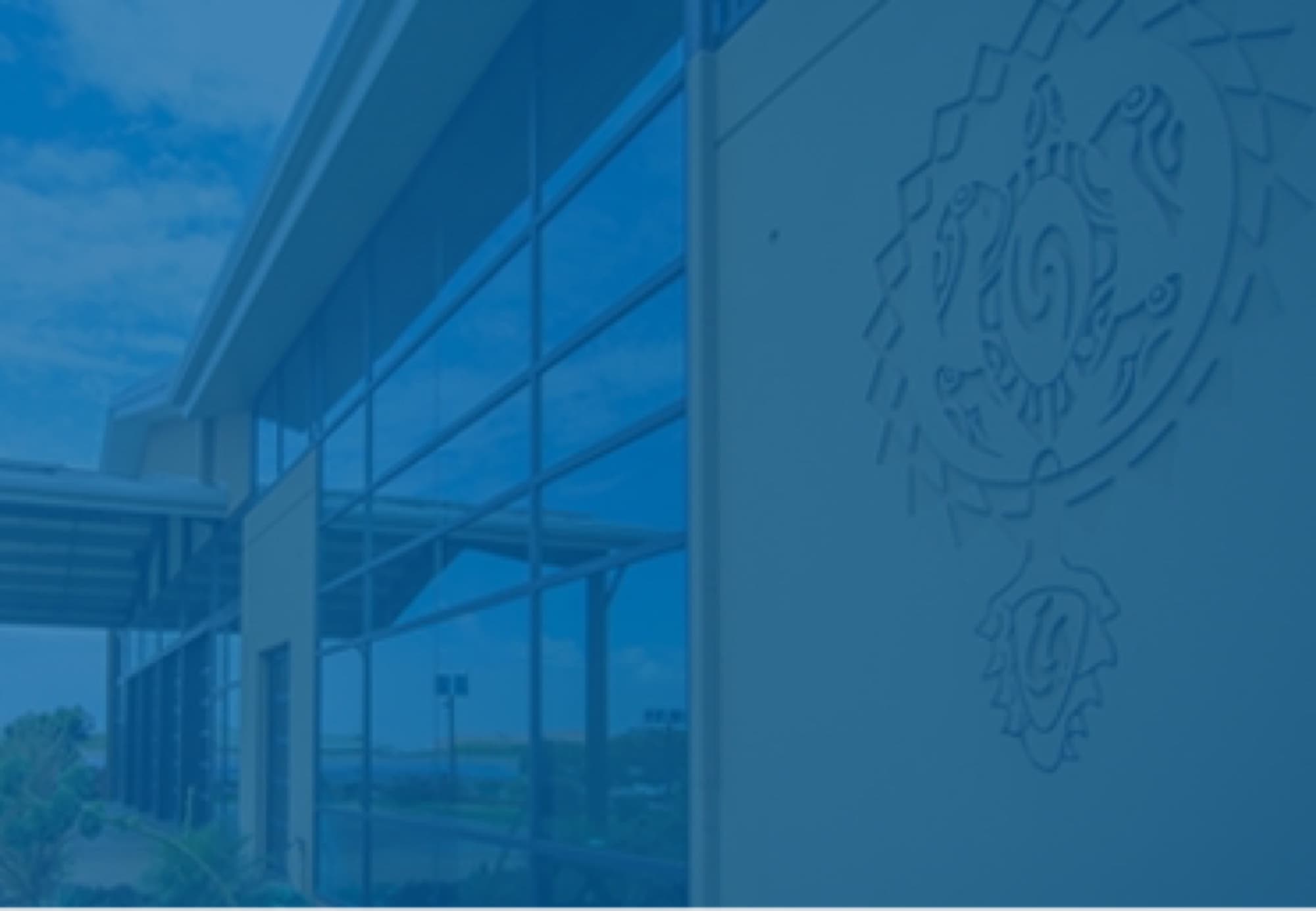Maui Brewing — Waikīkī — glass facade building logo