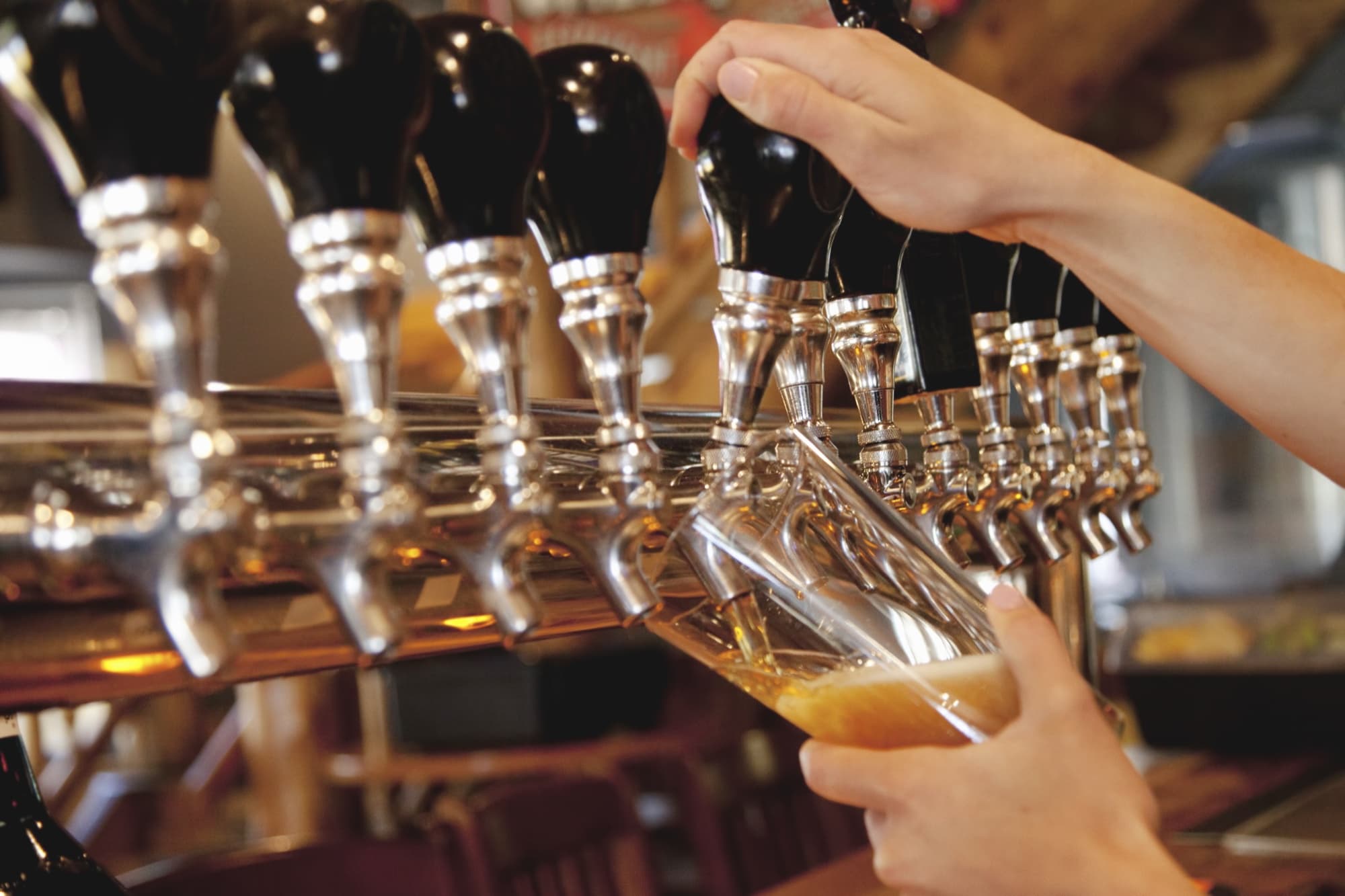 Three Peaks Brewing — tap handles row beer pour
